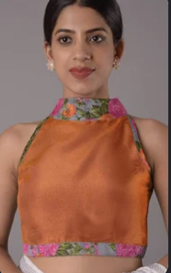Orange crepe fabric blouse with high neck design showing smooth texture and boutique tailoring finish