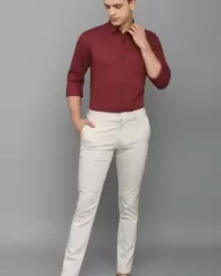 burgundy shirt and beige trousers